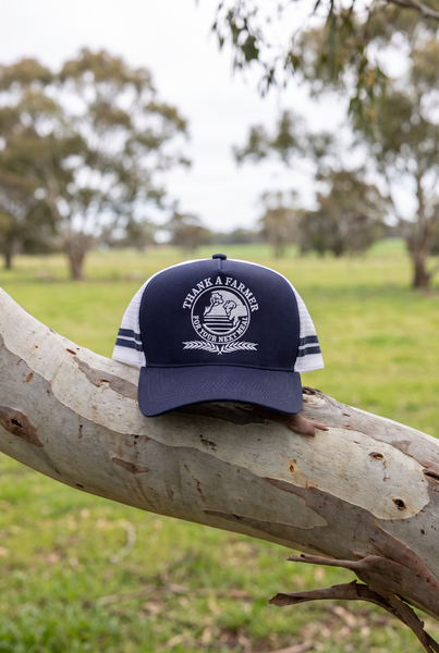 Navy and white striped trucker cap with globe crest on gum branch